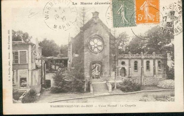 The façade of the Val-des-Bois chapel, with its rose window and steps, still standing amid the destroyed buildings around it.