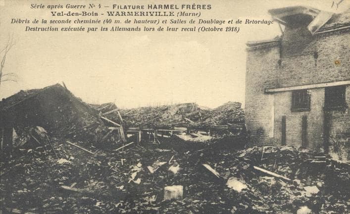 A field of rubble at the foot of a gutted brick building, after the German army destroyed the second chimney in October 1918.